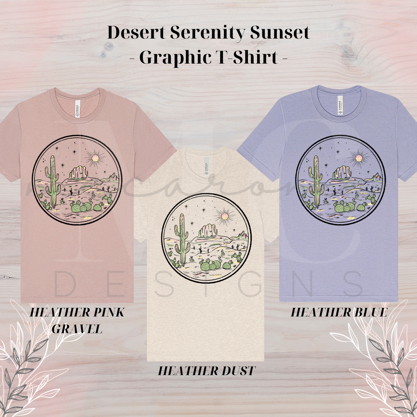Three graphic t-shirts in heather pink gravel, heather dust, and heather blue, each featuring a circular desert sunset scene with cacti, mountains, and sun.
